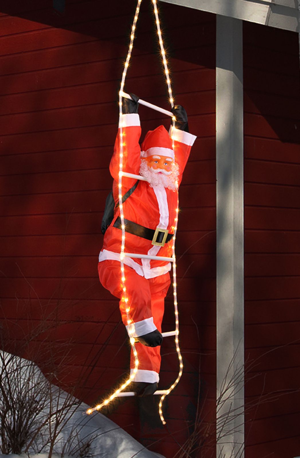 Weihnachtsmann Santa auf Leiter Lichtschlauch beleuchtet Weihnachten